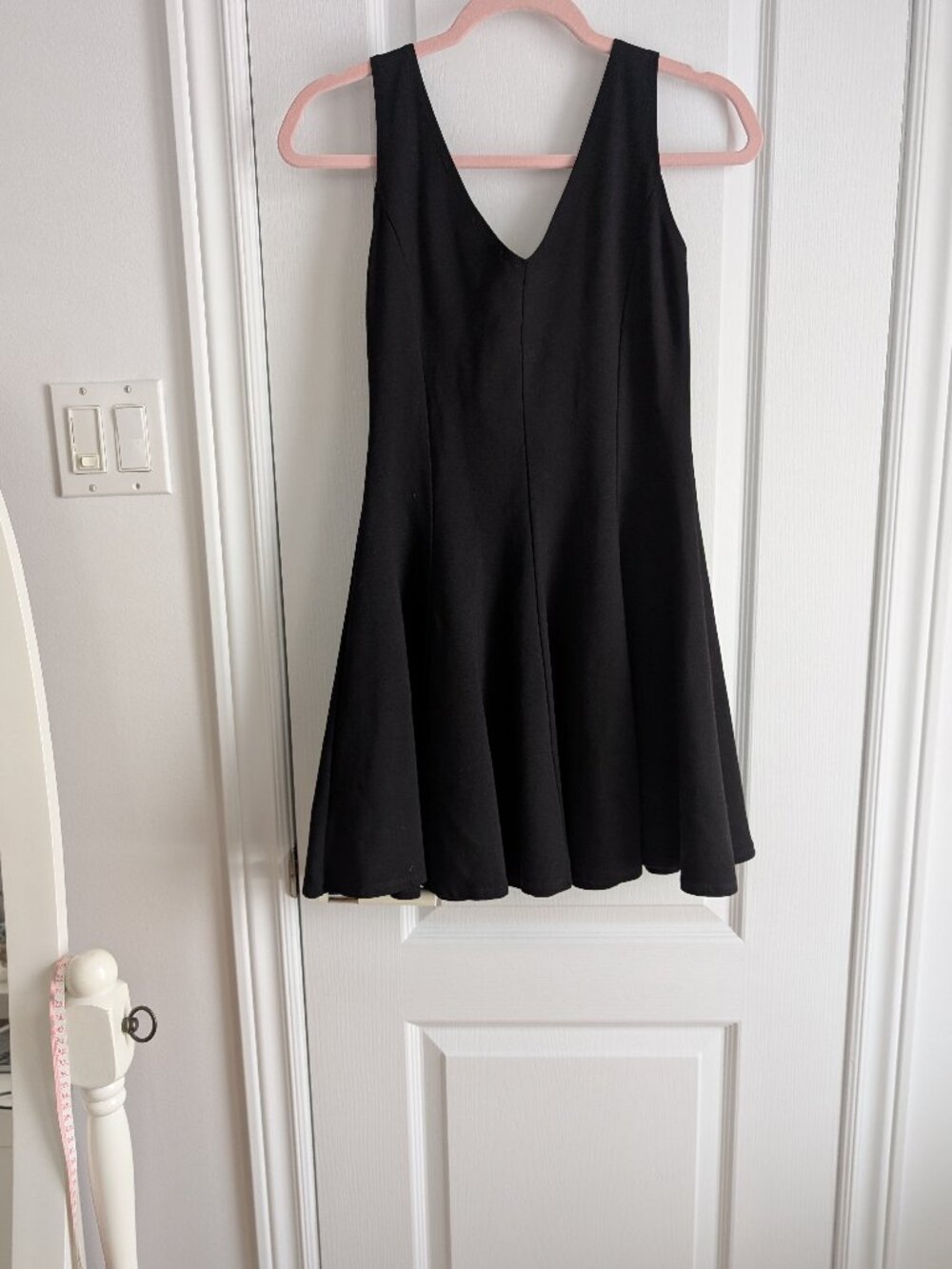 Little black dress. A-line. Vneck. Flares at the hem. Go anywhere dress. Small.